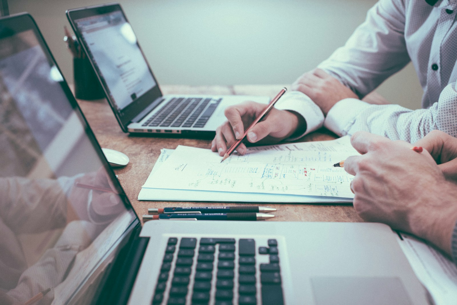 Estate planning session — wills, trusts and beneficiary notes on counsel table